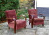 Pair of art deco club chairs, solid walnut steam bent arms.