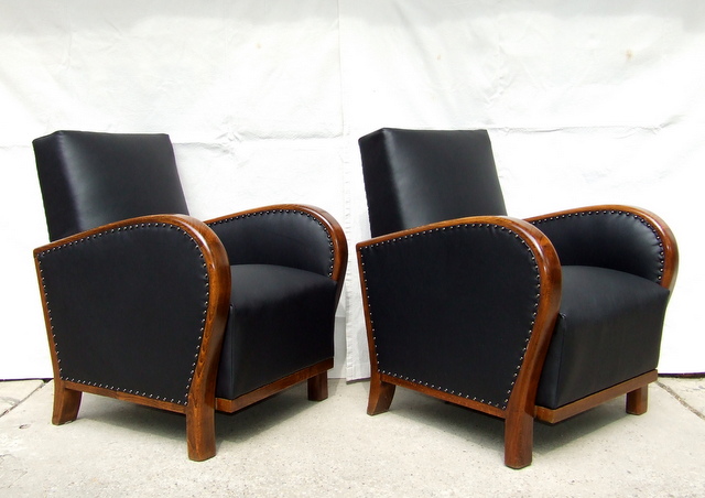 Black leather armchairs.