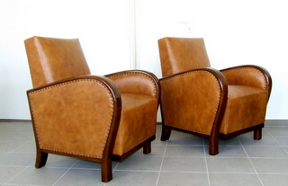 Pair of Art Deco leather upholstered armchairs.